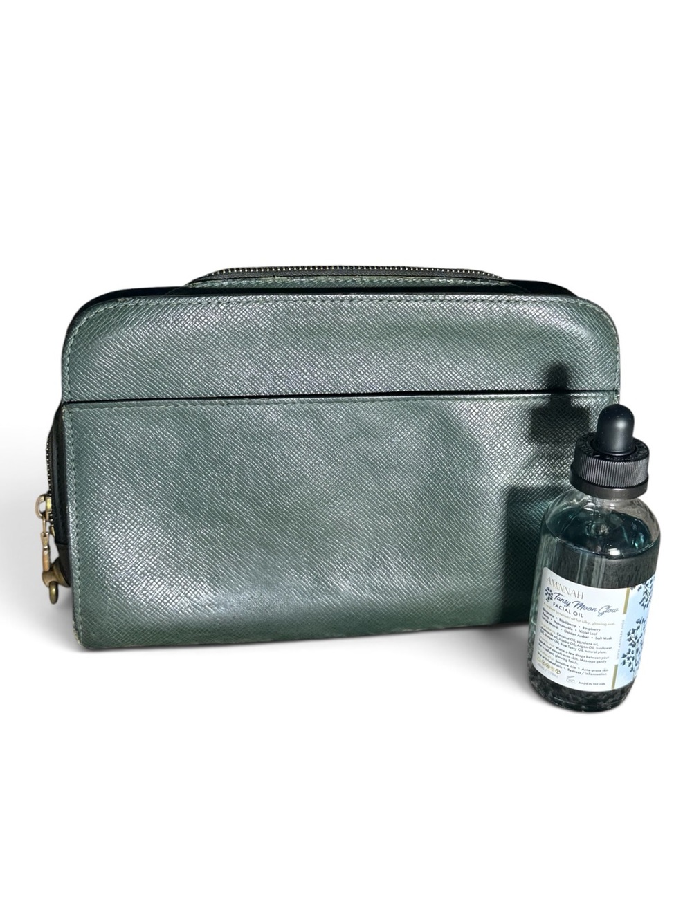 $380 Bundle: Louis Vuitton Green Taiga Leather Pouch & Aminnah Facial Oil